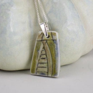 Incised Porcelain Pendant with Green