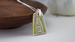 Incised Porcelain Pendant with Green